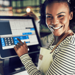 Woman smiling in front of Restaurant Point Of Sale System
