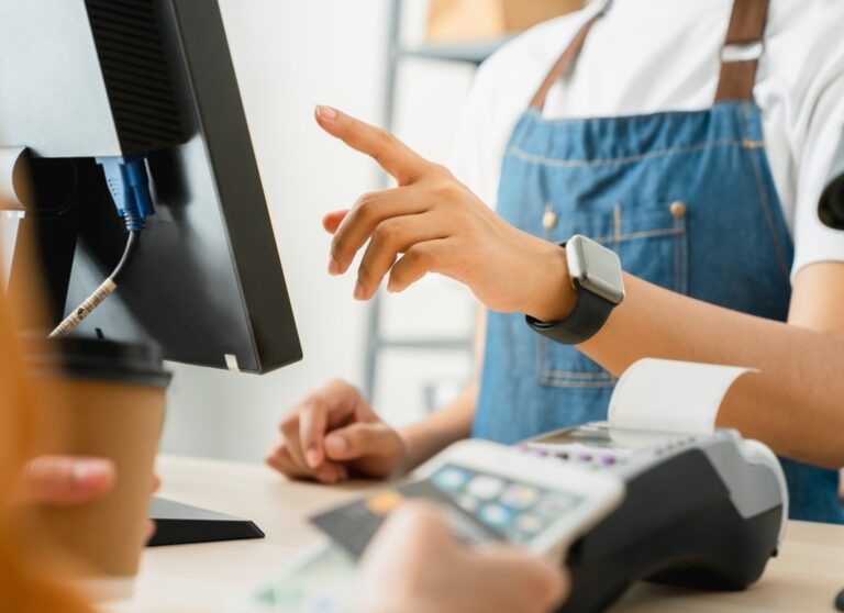 Cashier at pos terminal for credit card payment