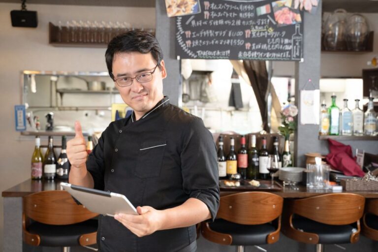 Restaurant Manager Using Tablet for Operations Management