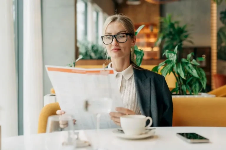 Restaurant owner reviewing a menu while evaluating pricing and profitability
