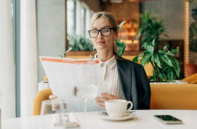 Restaurant owner reviewing a menu while evaluating pricing and profitability