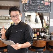 Restaurant Manager Using Tablet for Operations Management