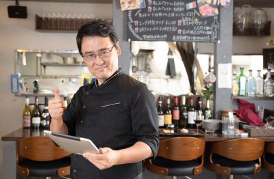 Restaurant Manager Using Tablet for Operations Management