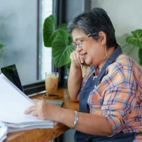 Restaurant operator reviewing invoices and reports while conducting a restaurant audit