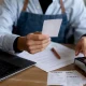 Restaurant Operator Reviewing Receipts and Financial Records at Desk